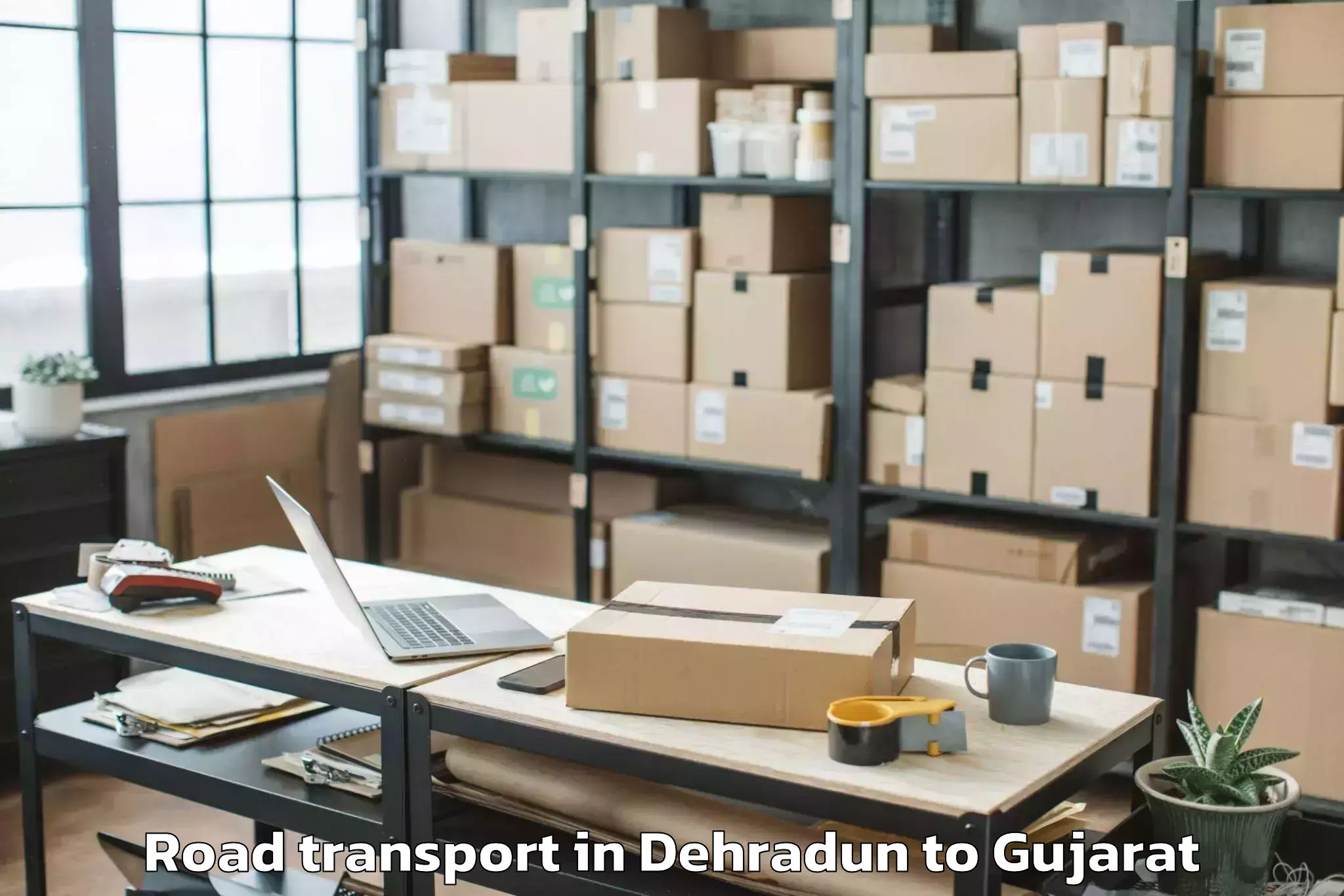 Expert Dehradun to Visavadar Road Transport